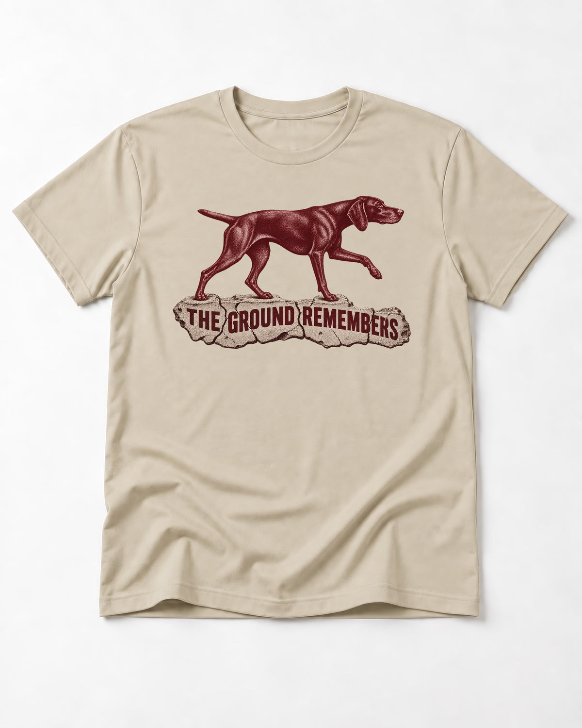 The Ground Remembers German Shorthaired Pointer T-Shirt in Sand, flat lay product photo