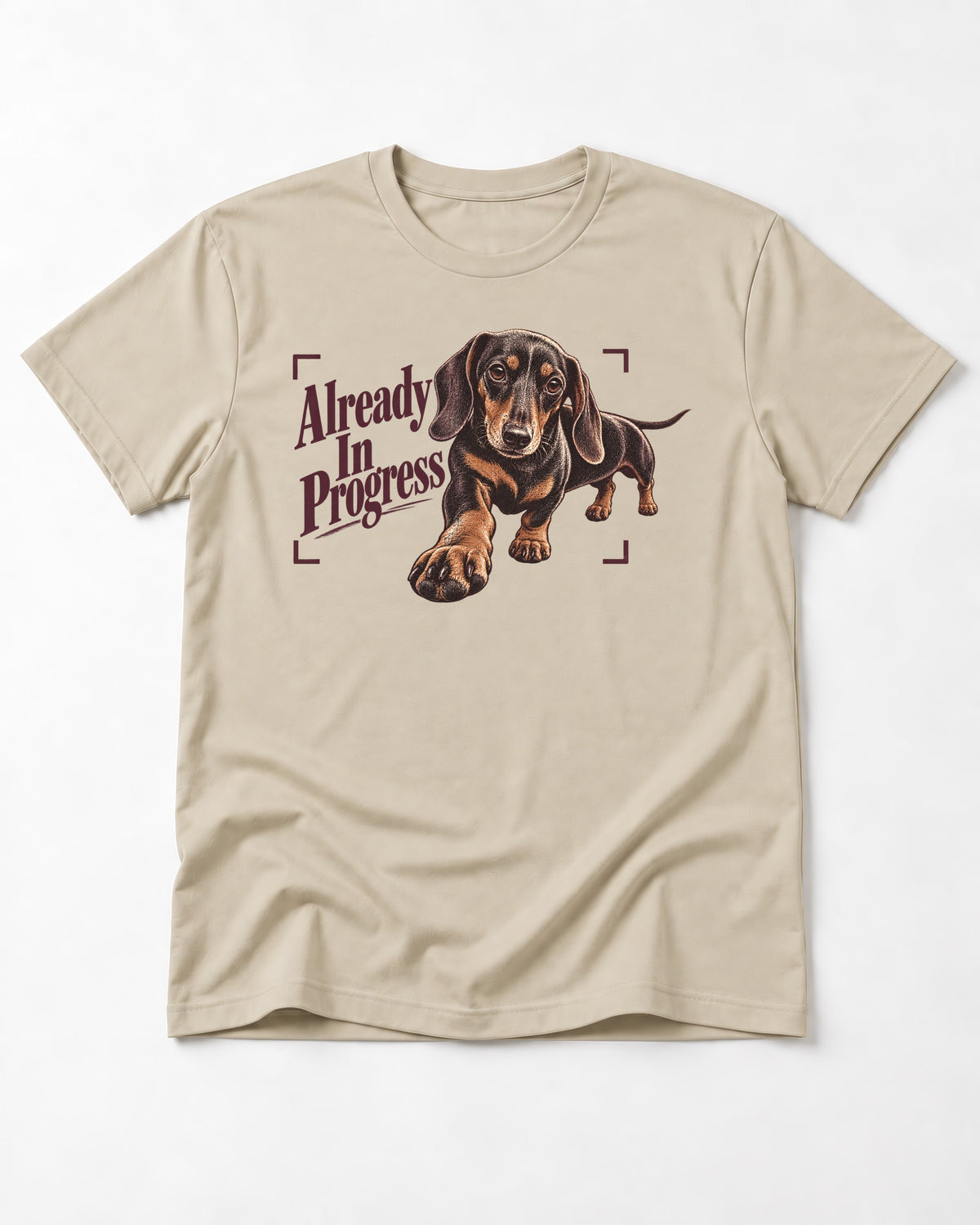 Dachshund Already in Progress T-Shirt in Sand, flat lay product photo