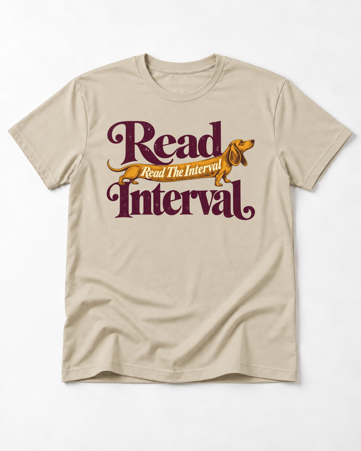Read the Dachshund Interval T-Shirt in Sand, flat lay product photo