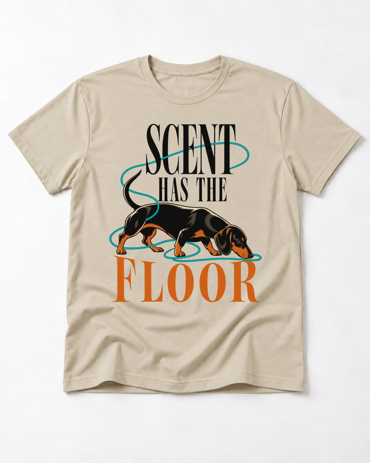 Dachshund Scent Has the Floor T-Shirt in Sand, flat lay product photo