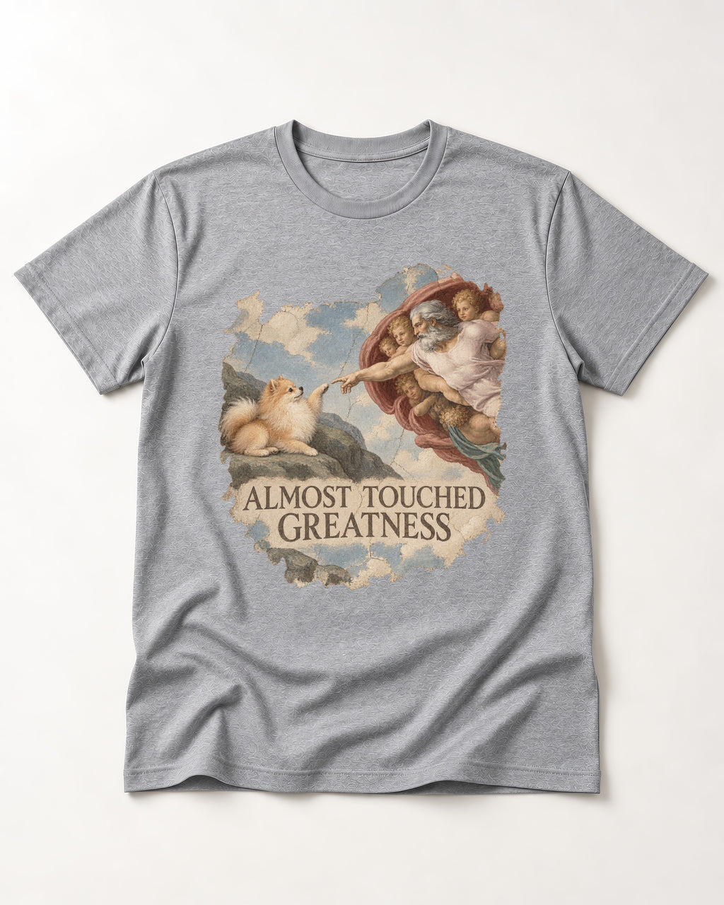 Pomeranian Almost Touched Greatness Fresco Graphic T-Shirt in Sport Grey, flat lay product photo