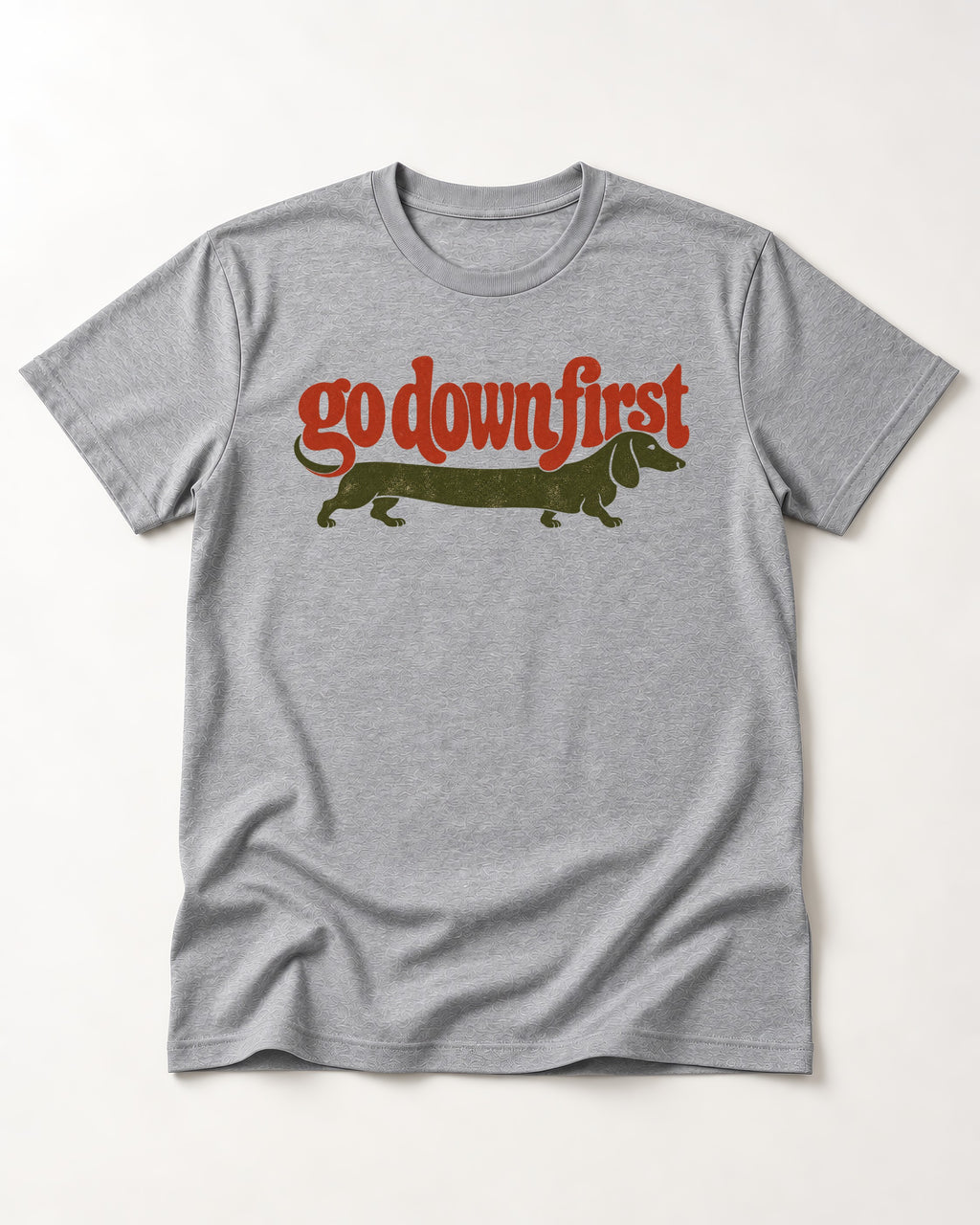 Dachshund Goes Down First T-Shirt in Sport Grey, flat lay product photo
