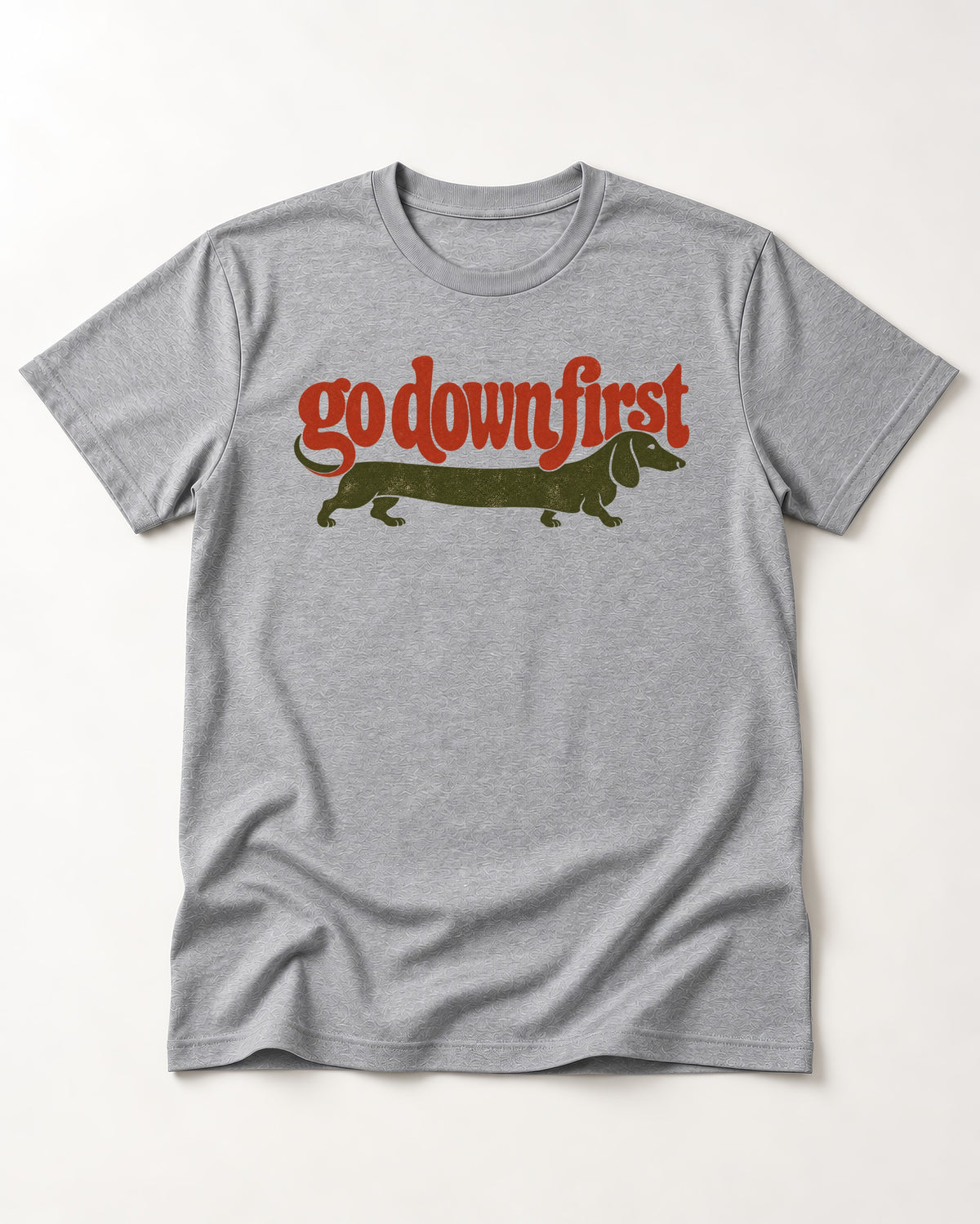 Dachshund Goes Down First T-Shirt in Sport Grey, flat lay product photo