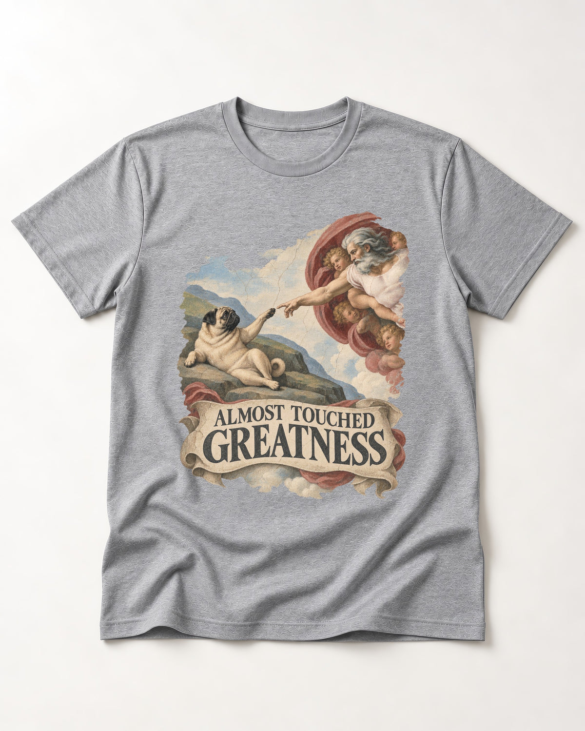 Pug Almost Touched Greatness Creation Parody Graphic T-Shirt in Sport Grey, flat lay product photo
