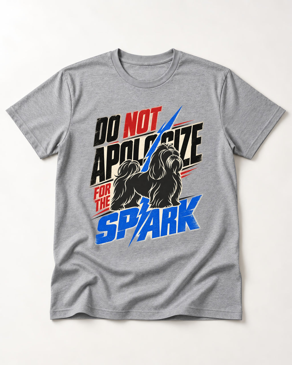 Never Apologize for Shih Tzu Spark T-Shirt in Sport Grey, flat lay product photo