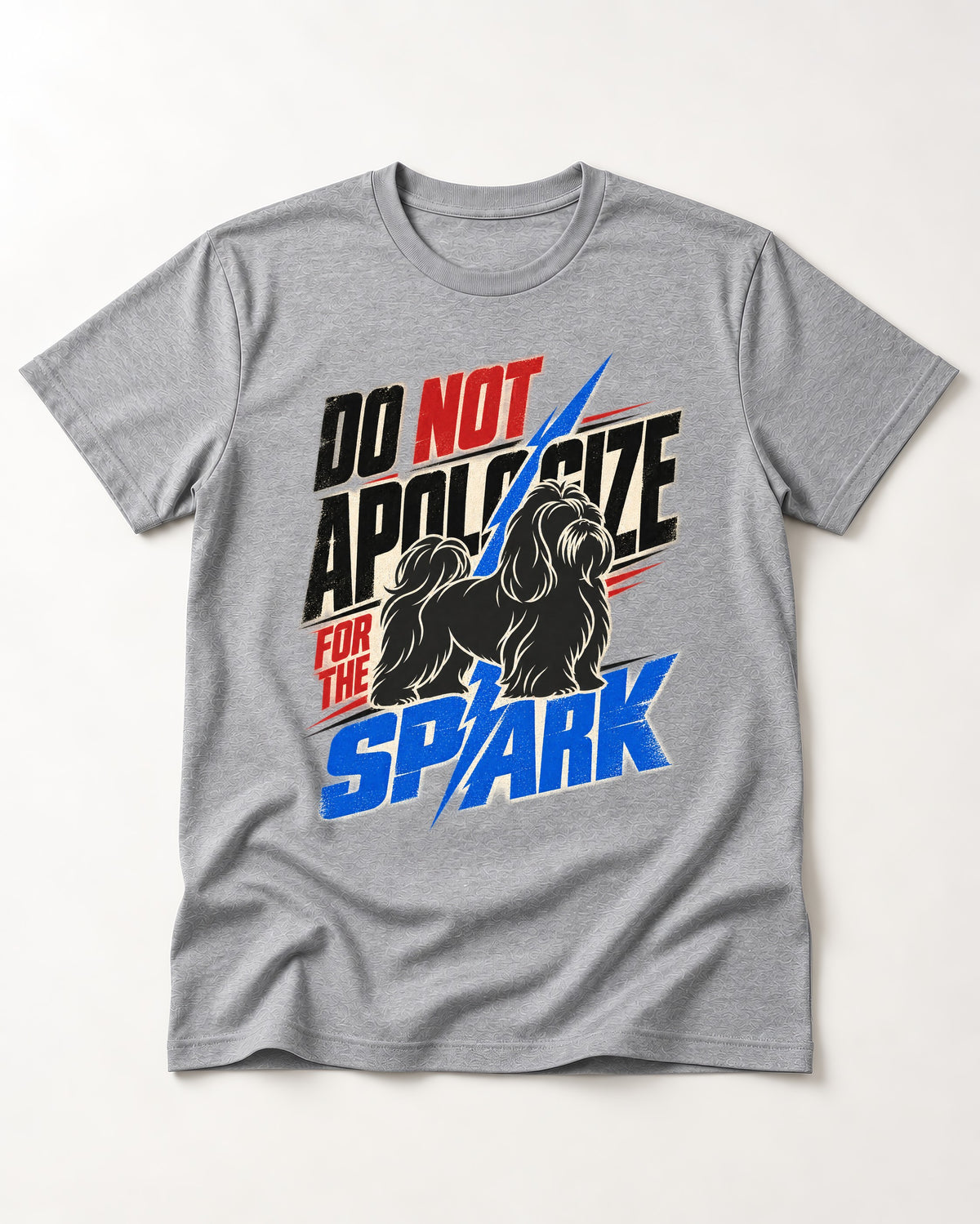Never Apologize for Shih Tzu Spark T-Shirt in Sport Grey, flat lay product photo
