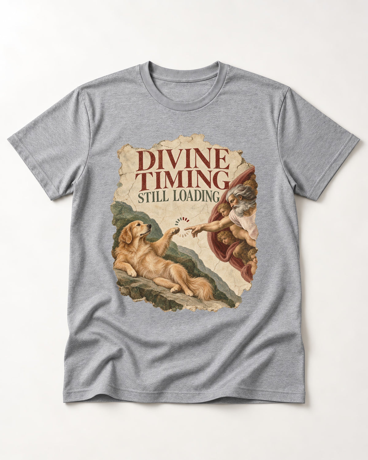 Divine Timing Still Loading Creation Scene Golden Retriever Graphic T-Shirt in Sport Grey, flat lay product photo