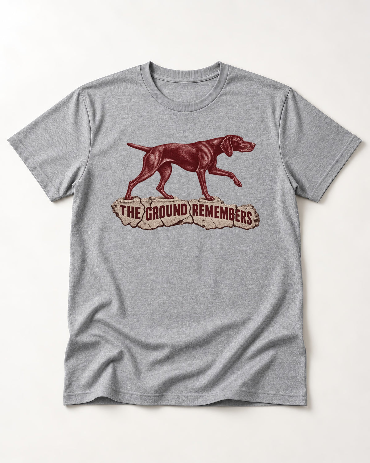 The Ground Remembers German Shorthaired Pointer T-Shirt in Sport Grey, flat lay product photo