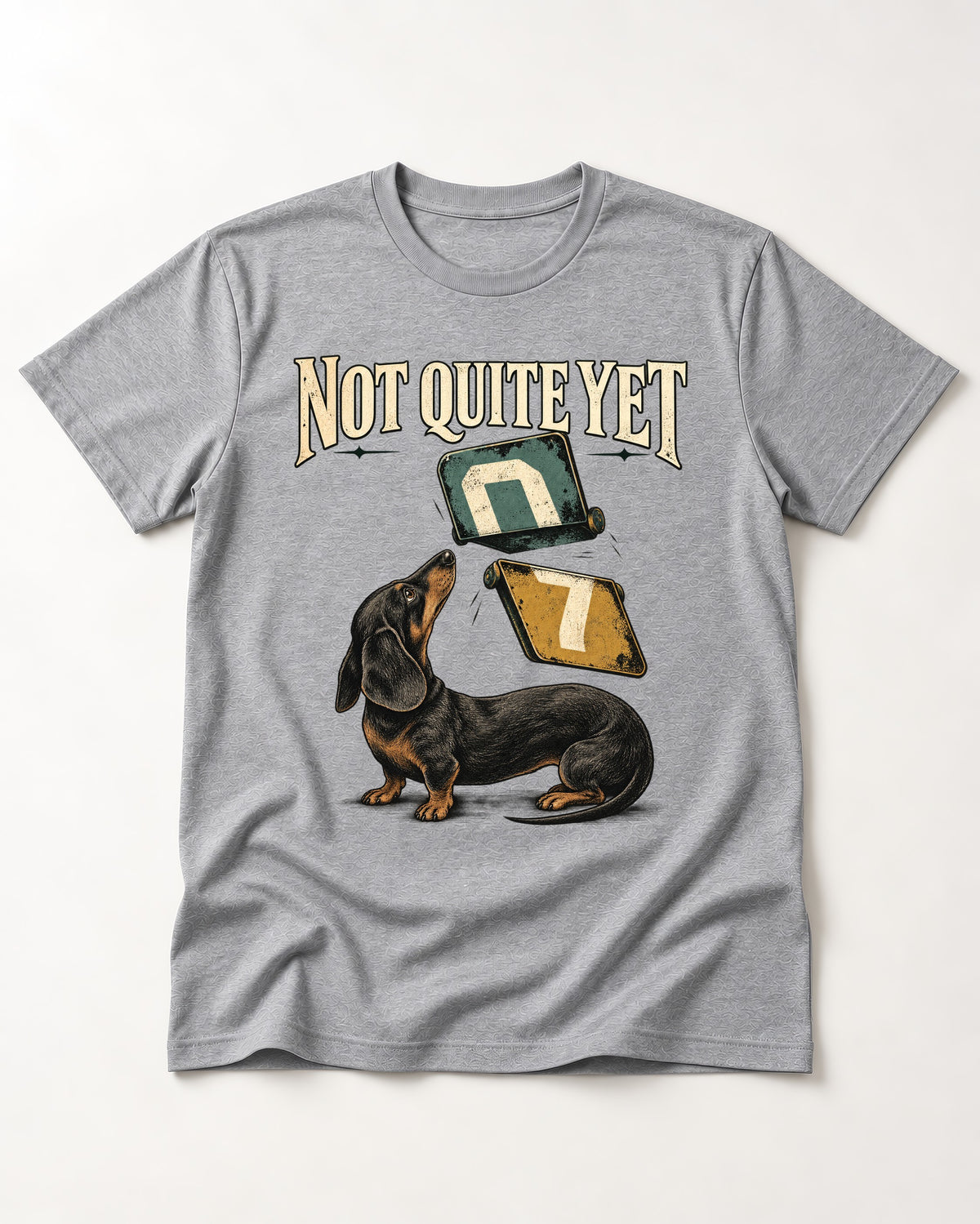 Not Quite Yet Dachshund T-Shirt in Sport Grey, flat lay product photo