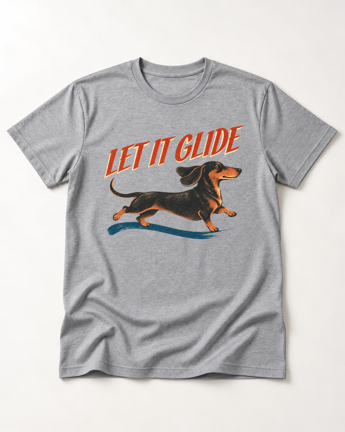 Let It Glide Dachshund T-Shirt in Sport Grey, flat lay product photo