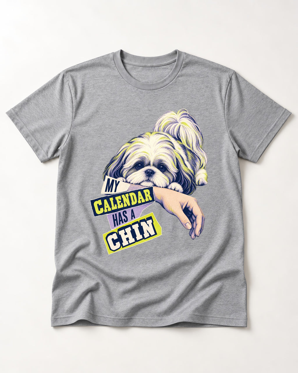 Shih Tzu My Calendar Has a Chin Arm Rest Graphic T-Shirt in Sport Grey, flat lay product photo