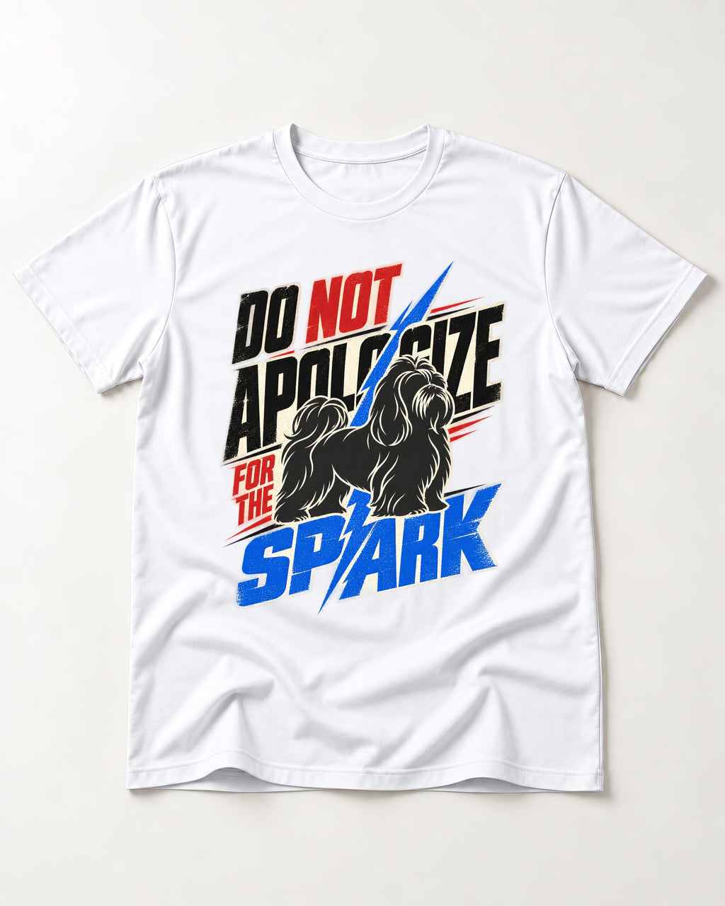 Never Apologize for Shih Tzu Spark T-Shirt in White, flat lay product photo