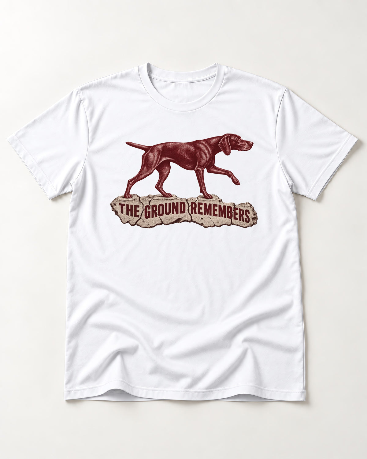 The Ground Remembers German Shorthaired Pointer T-Shirt in White, flat lay product photo