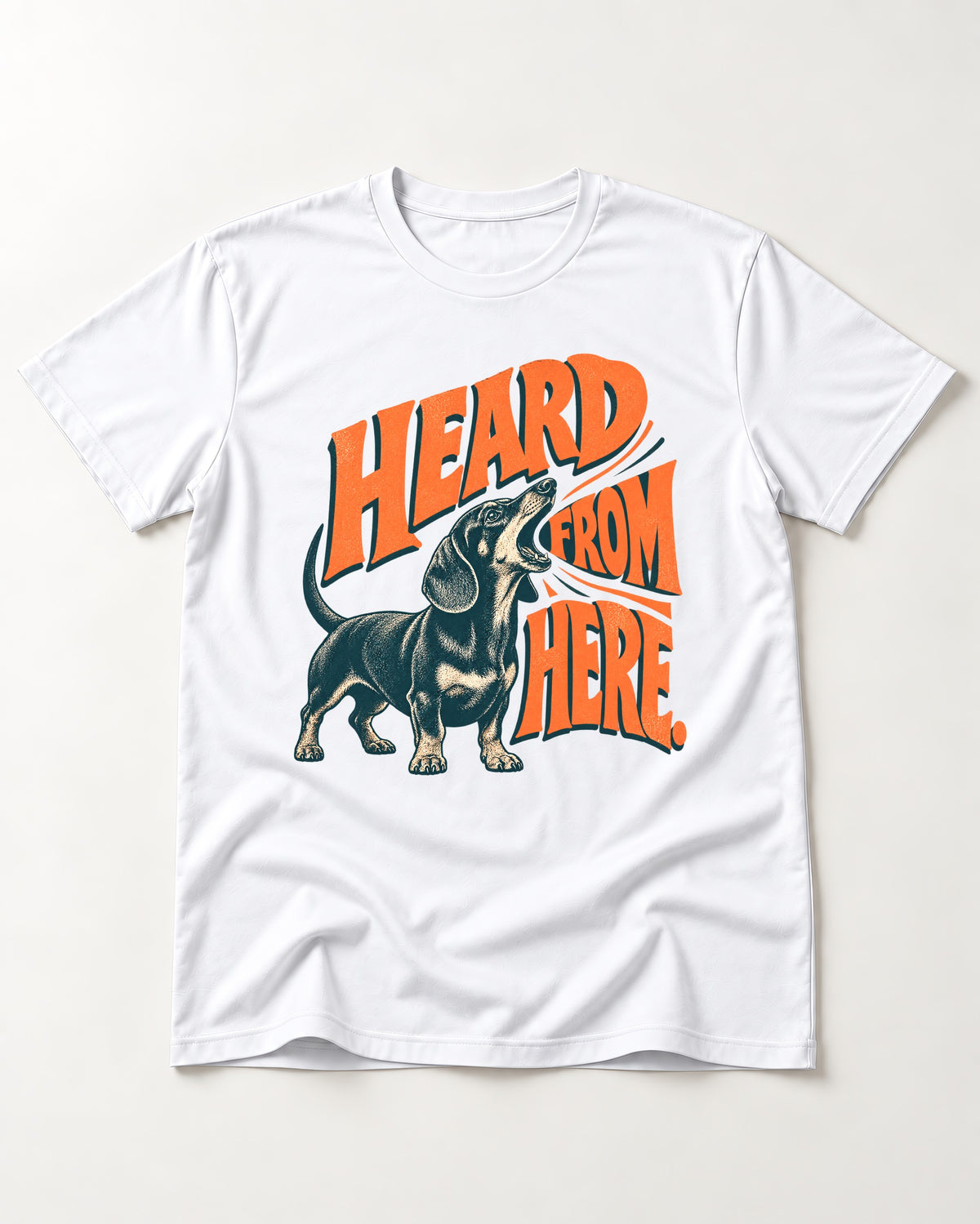 Dachshund Heard From Here T-Shirt in White, flat lay product photo