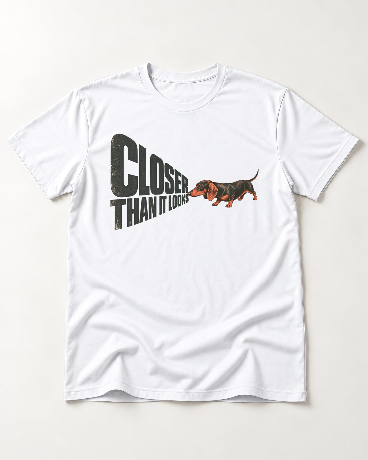 Dachshund Closer Than It Looks T-Shirt in White, flat lay product photo