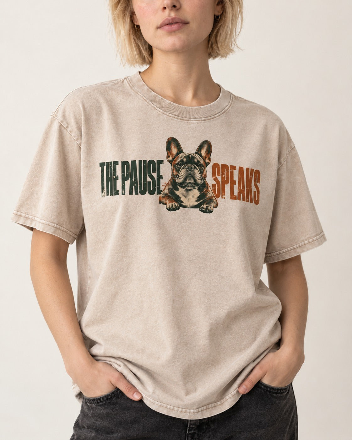 The Frenchie Pause Speaks Washed Tee in Apricot, worn by a model, front view
