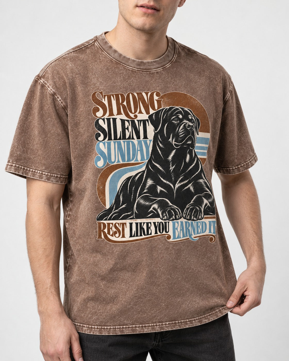 Strong Silent Sunday Rottweiler Washed Tee in Coffee, worn by a model, front view
