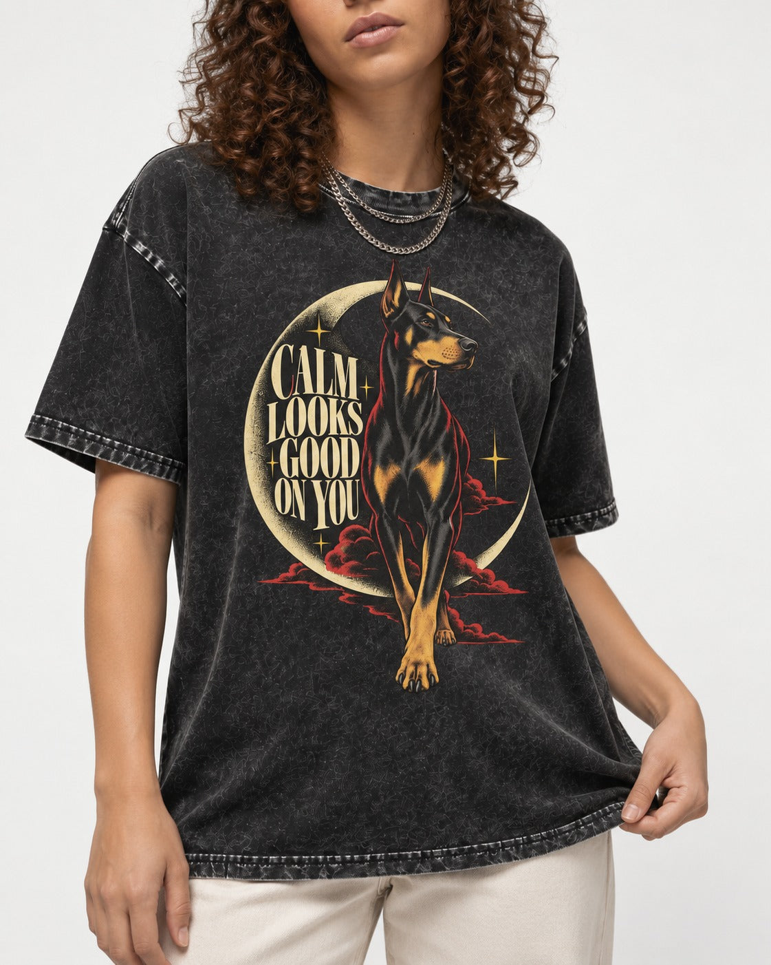 Doberman Calm Looks Good on You Crescent Graphic Washed Tee in Black, worn by a model, front view
