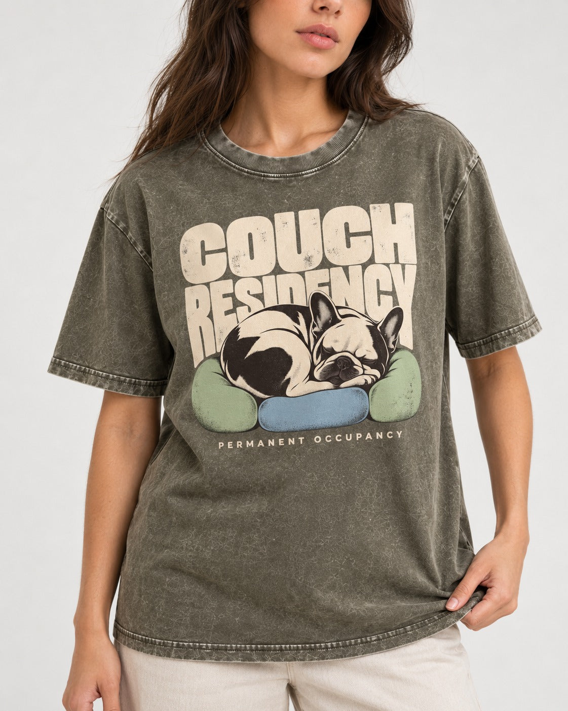 Frenchie Couch Residency Permanent Occupancy Cushion Graphic Washed Tee in Army Green, worn by a model, front view