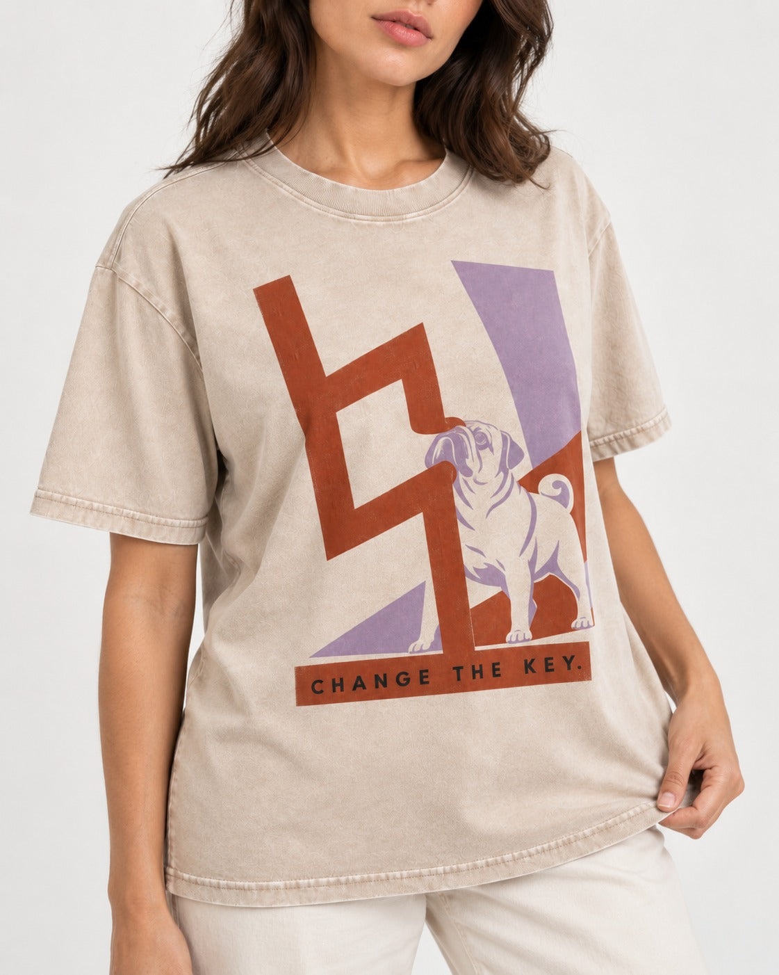 Pug Change the Key Washed Tee in Apricot, worn by a model, front view