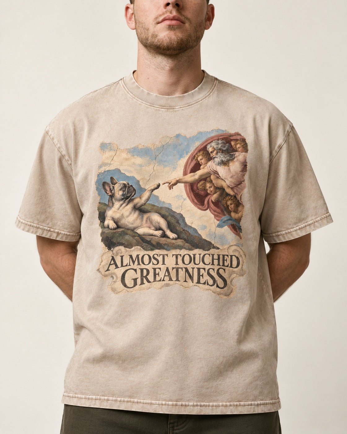 Frenchie Almost Touched Greatness Washed Tee in Apricot, worn by a model, front view