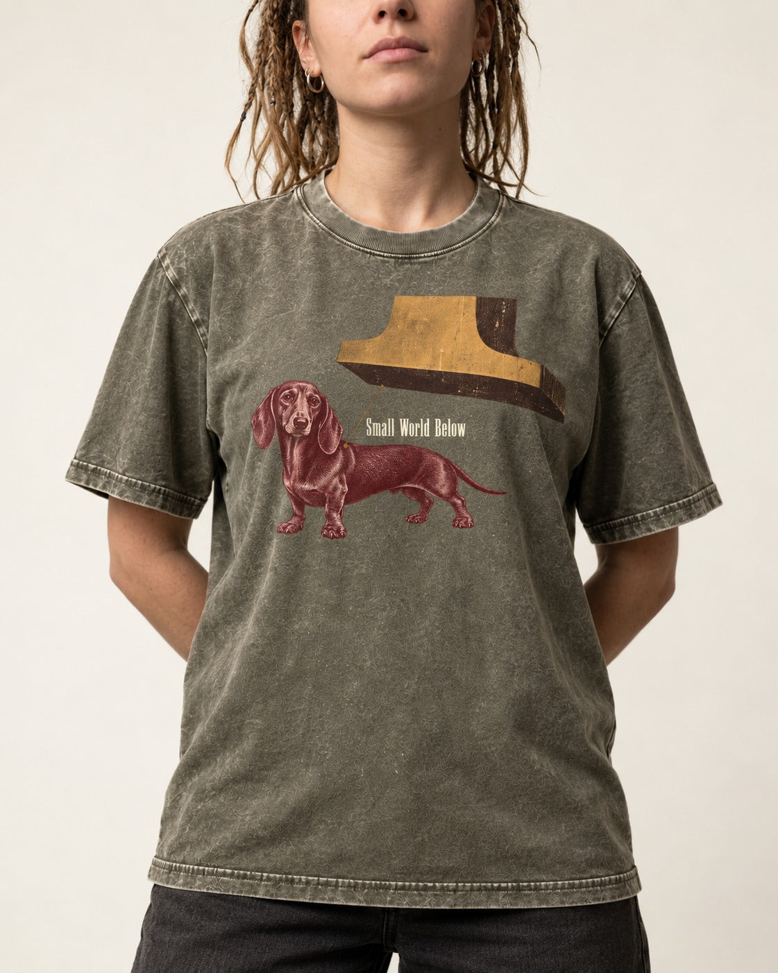 Dachshund Small World Below Giant Shoe Graphic Washed Tee in Army Green, worn by a model, front view