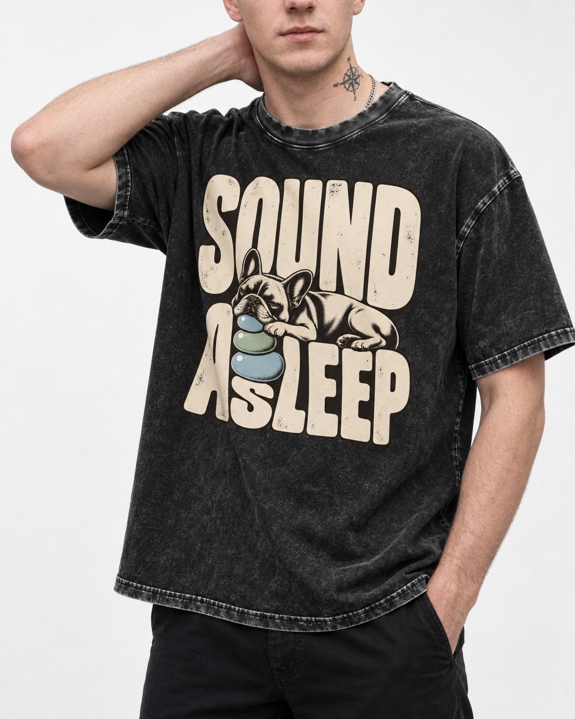 Frenchie Sound Asleep Stone Pillow Graphic Washed Tee in Black, worn by a model, front view