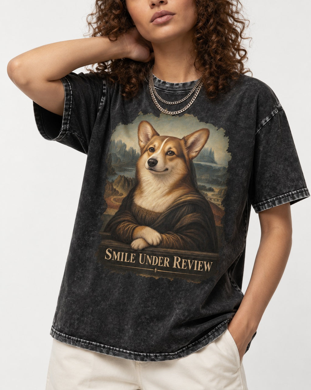 Corgi Smile Under Review Mona Lisa Portrait Washed Tee in Black, worn by a model, front view