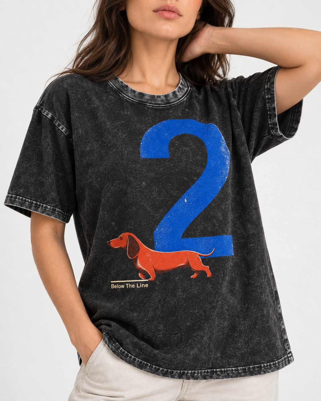 Dachshund Below The Line Number Two Graphic Washed Tee in Black, worn by a model, front view
