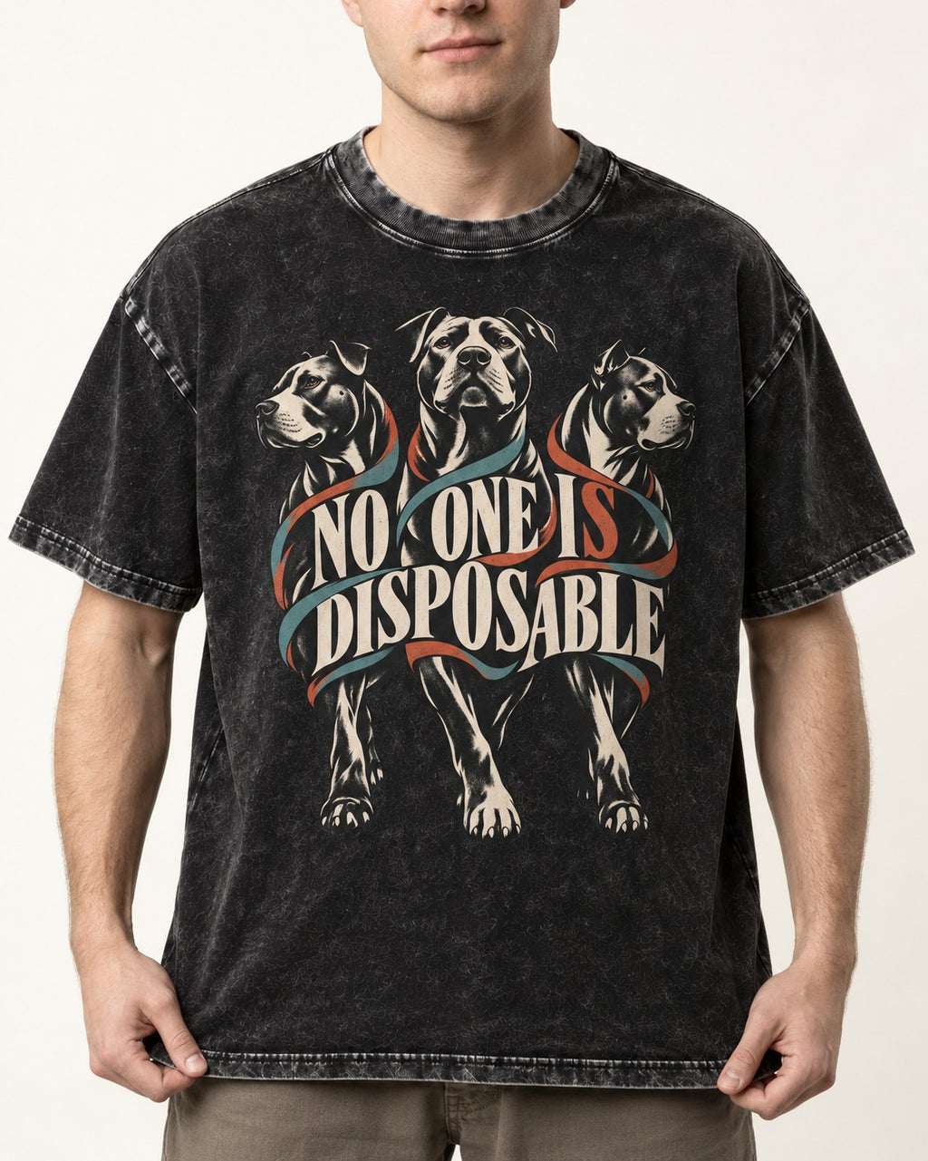 Pitbull No One Is Disposable Three Dogs Graphic Washed Tee in Black, worn by a model, front view