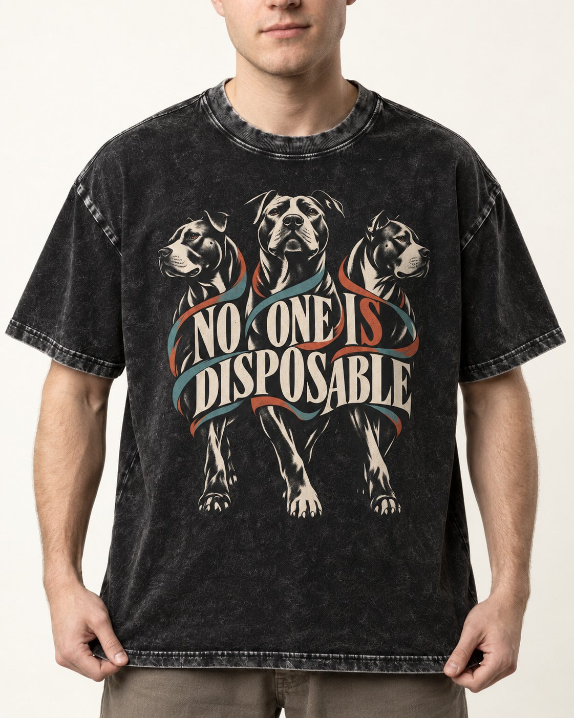 Pitbull No One Is Disposable Three Dogs Graphic Washed Tee in Black, worn by a model, front view