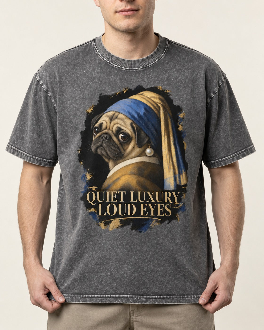 Pug Quiet Luxury Loud Eyes Pearl Portrait Graphic Washed Tee in Gray, worn by a model, front view