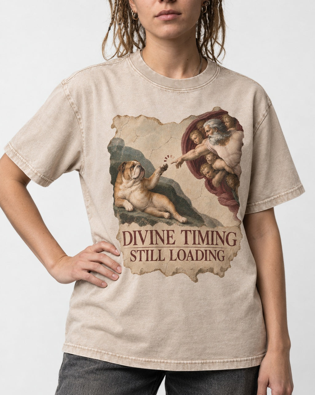 English Bulldog Divine Timing Still Loading Washed Tee in Apricot, worn by a model, front view