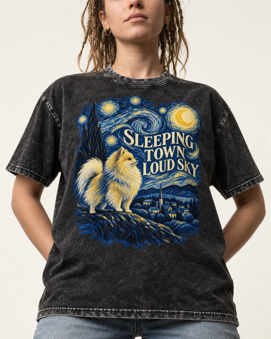 Pomeranian Sleeping Town Loud Sky Starry Night Graphic Washed Tee in Black, worn by a model, front view