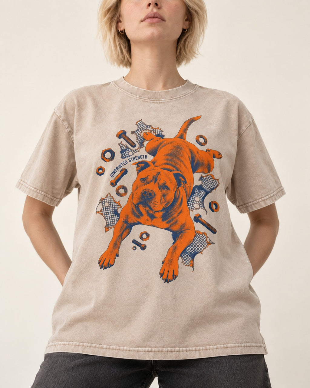 Pitbull Strength Washed Tee in Apricot, worn by a model, front view