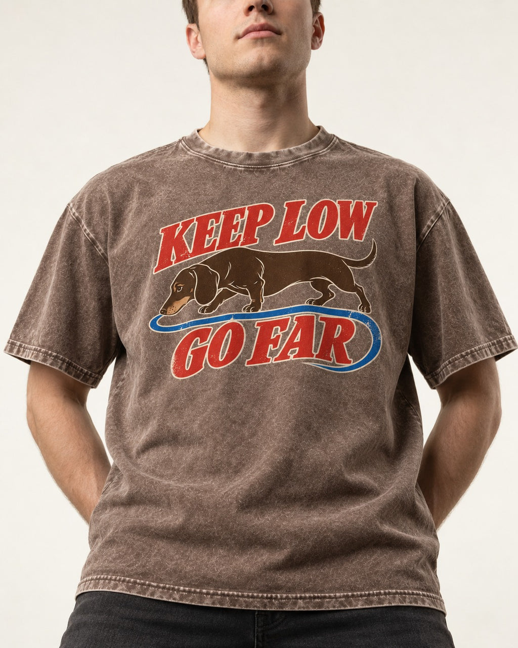 Dachshund Keep Low Go Far Washed Tee in Coffee, worn by a model, front view