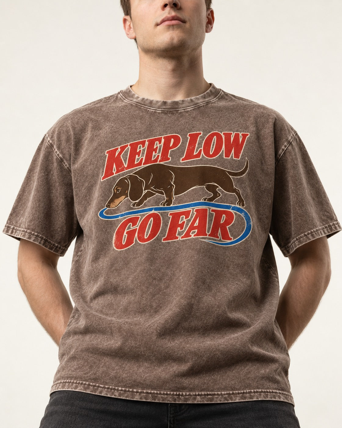 Dachshund Keep Low Go Far Washed Tee in Coffee, worn by a model, front view