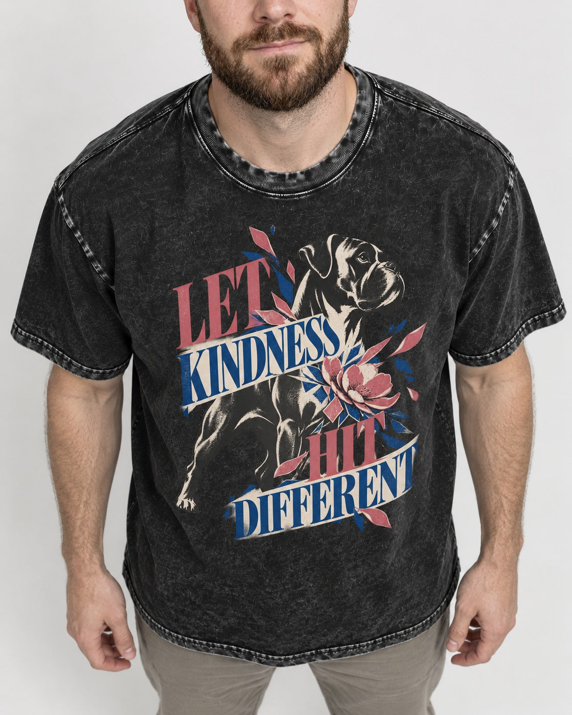 Let Kindness Hit Different Boxer Floral Collage Washed Tee in Black, worn by a model, front view