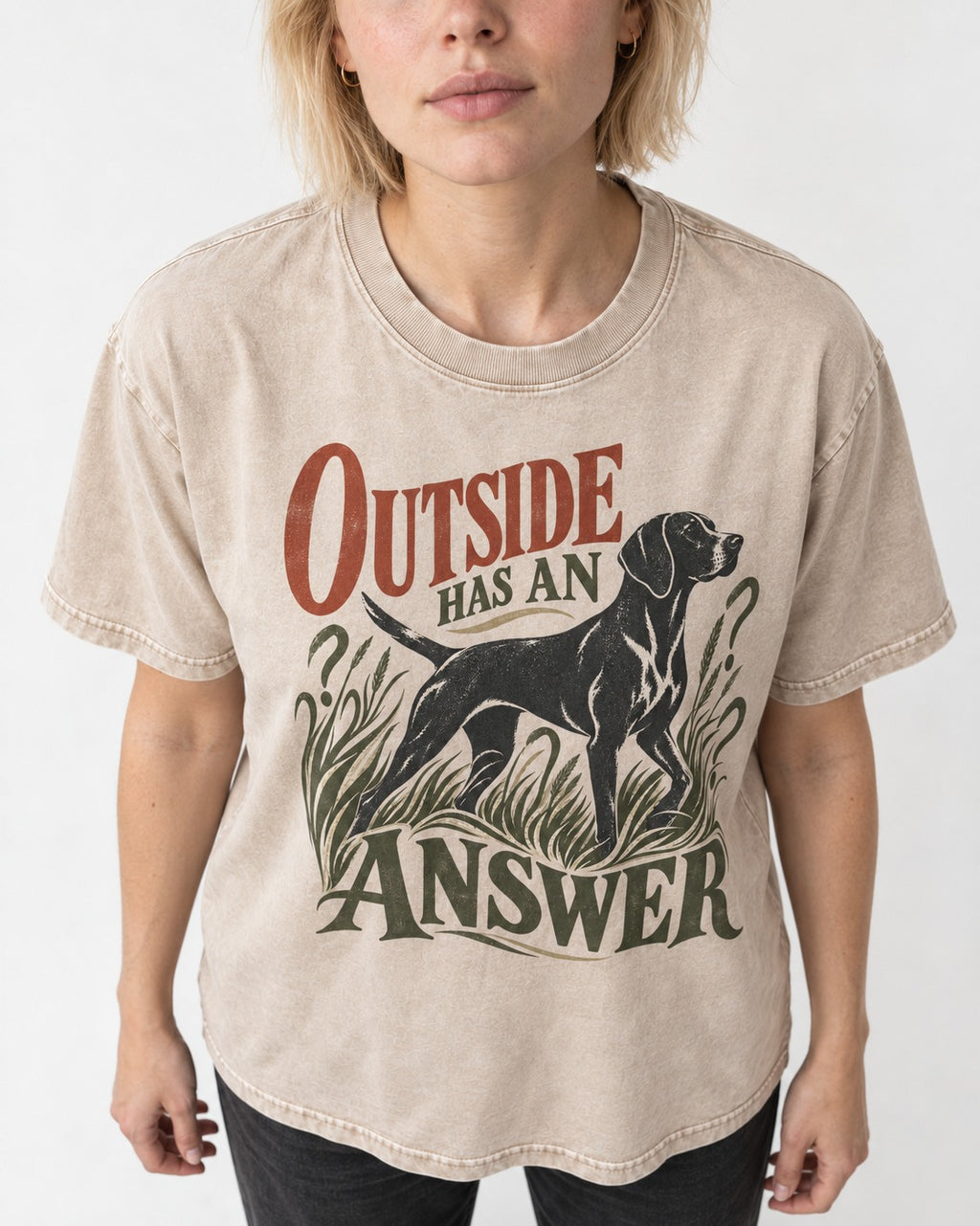 Outside Has an Answer German Shorthaired Pointer Washed Tee in Apricot, worn by a model, front view
