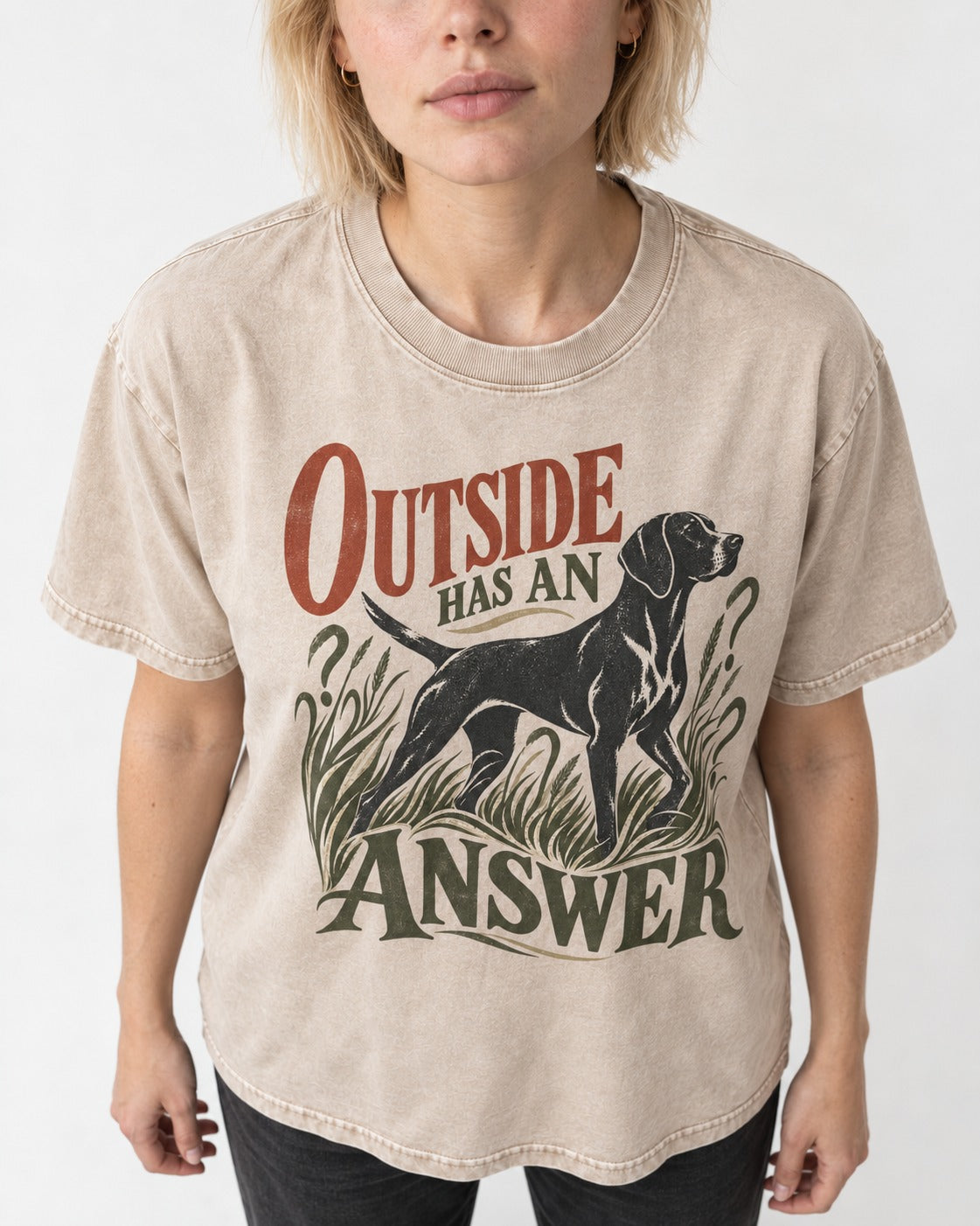 Outside Has an Answer German Shorthaired Pointer Washed Tee in Apricot, worn by a model, front view
