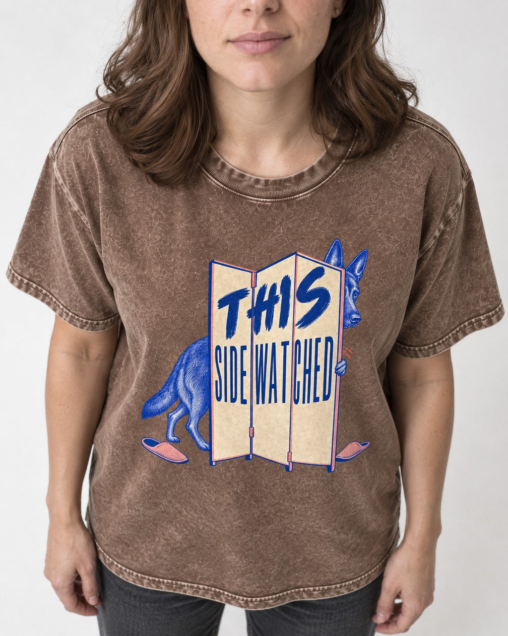 This Side Watched by German Shepherd Dog Washed Tee in Coffee, worn by a model, front view
