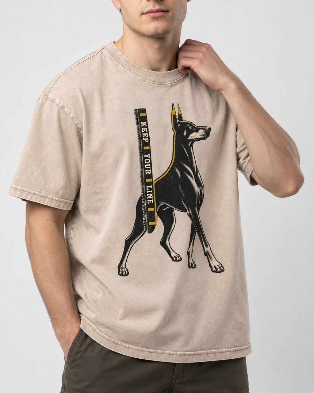 Keep Your Line Doberman Washed Tee in Apricot, worn by a model, front view