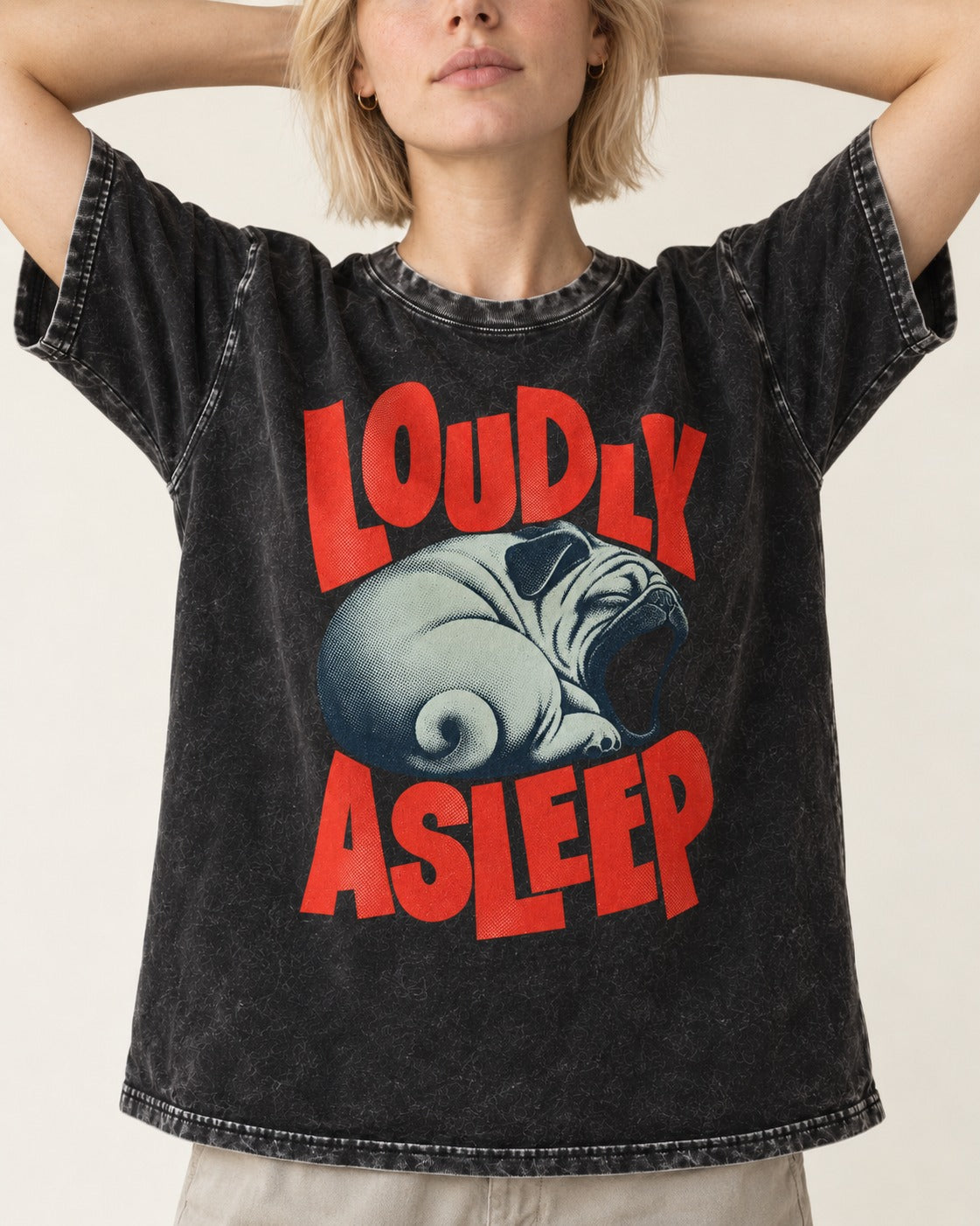 Pug Loudly Asleep Curled Yawn Graphic Washed Tee in Black, worn by a model, front view