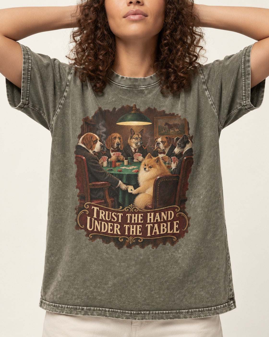 Pomeranian Trust the Hand Under the Table Poker Dogs Graphic Washed Tee in Army Green, worn by a model, front view