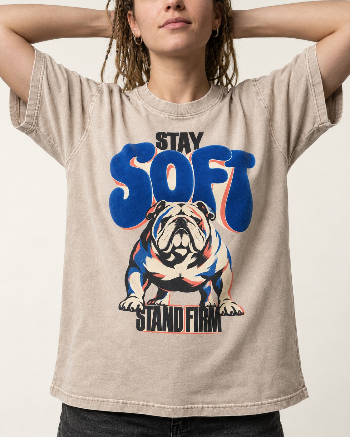 Stay Soft Stand Firm English Bulldog Washed Tee in Apricot, worn by a model, front view