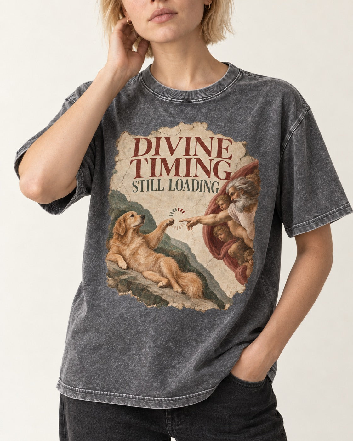 Divine Timing Still Loading Creation Scene Golden Retriever Graphic Washed Tee in Gray, worn by a model, front view
