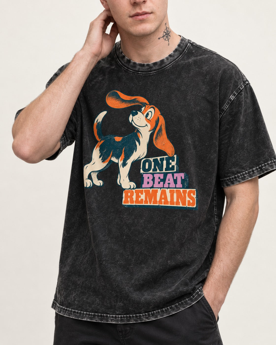 Retro Beagle One Beat Remains Washed Tee in Black, worn by a model, front view