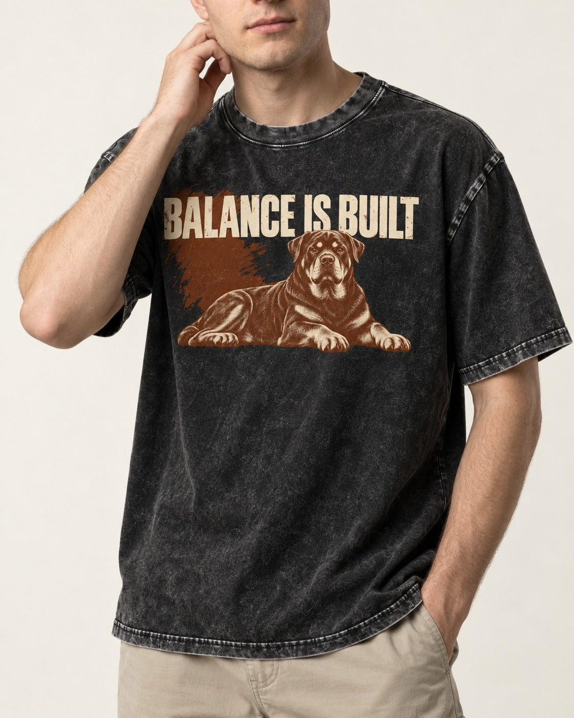 Rottweiler Balance Is Built Resting Strength Graphic Washed Tee in Black, worn by a model, front view