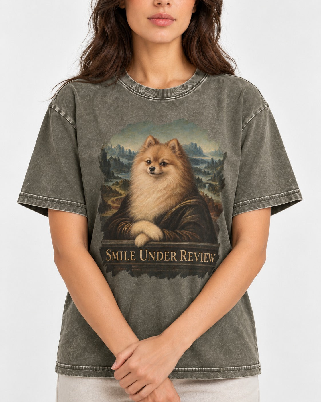 Pomeranian Smile Under Review Renaissance Portrait Graphic Washed Tee in Army Green, worn by a model, front view