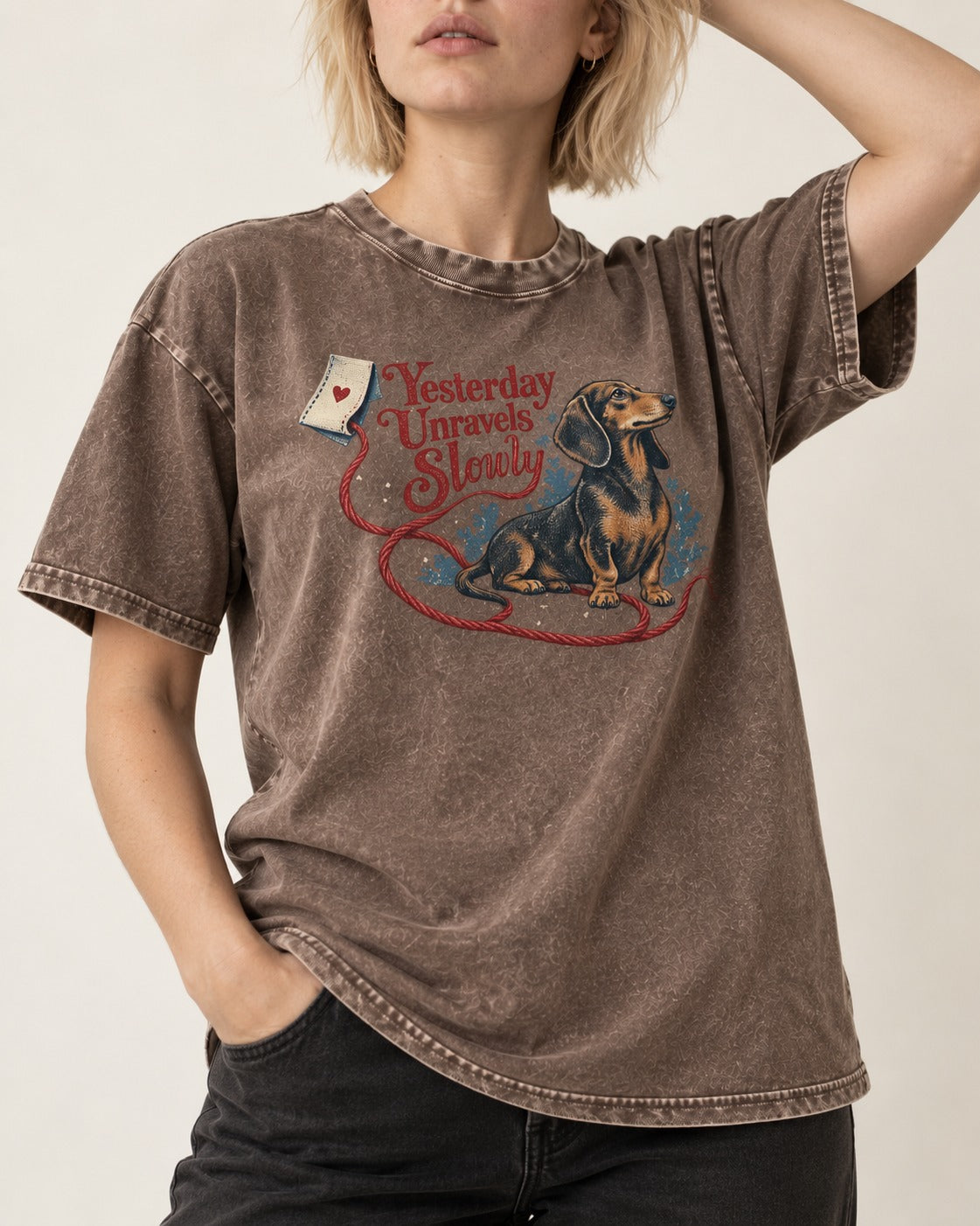 Yesterday Unravels Slowly with Dachshund Washed Tee in Coffee, worn by a model, front view